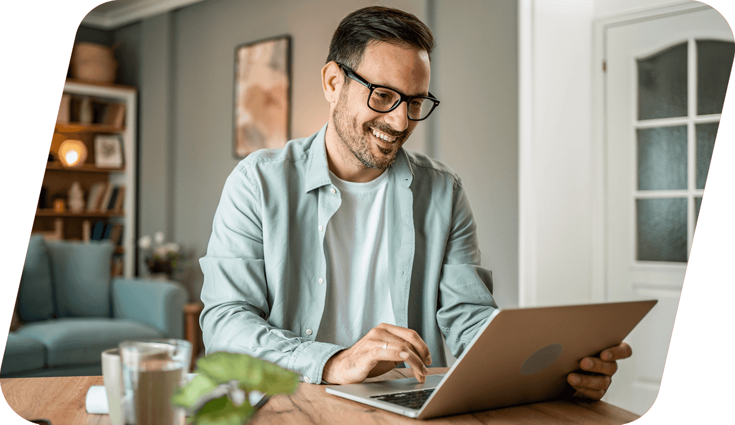 Two people surfing the web on a laptop